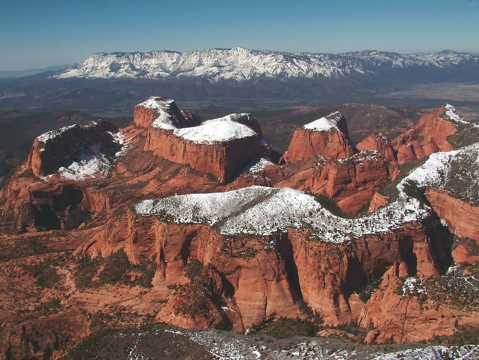 Snow over red rock canyon